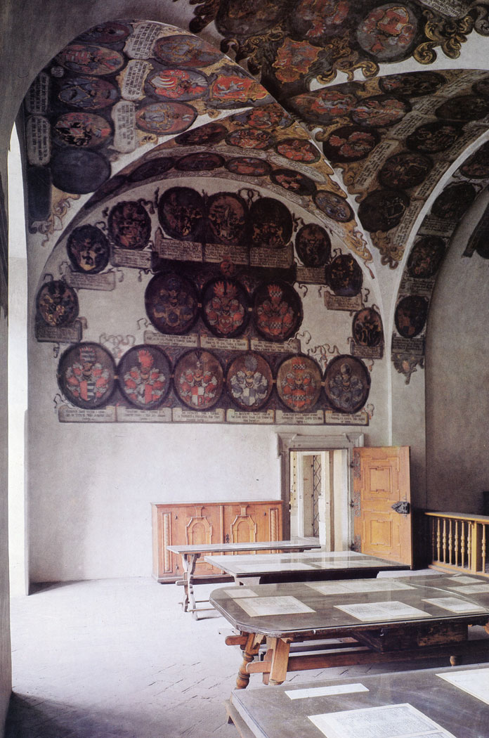 'Apart from important resolutions passed by the Diet the Land Rolls recorded all changes in property holdings of the Estates in the Czech Lands. During the Fire of 1541 the original premises of the Land Rolls were destroyed and with it all the old Land Rolls. The new Office was built in Renaissance style in the middle of the 16th century. The ceilings and the walls are adorned with the coats-of-arms of the Clerks of the Land Rolls during the period 1606 to 1758.