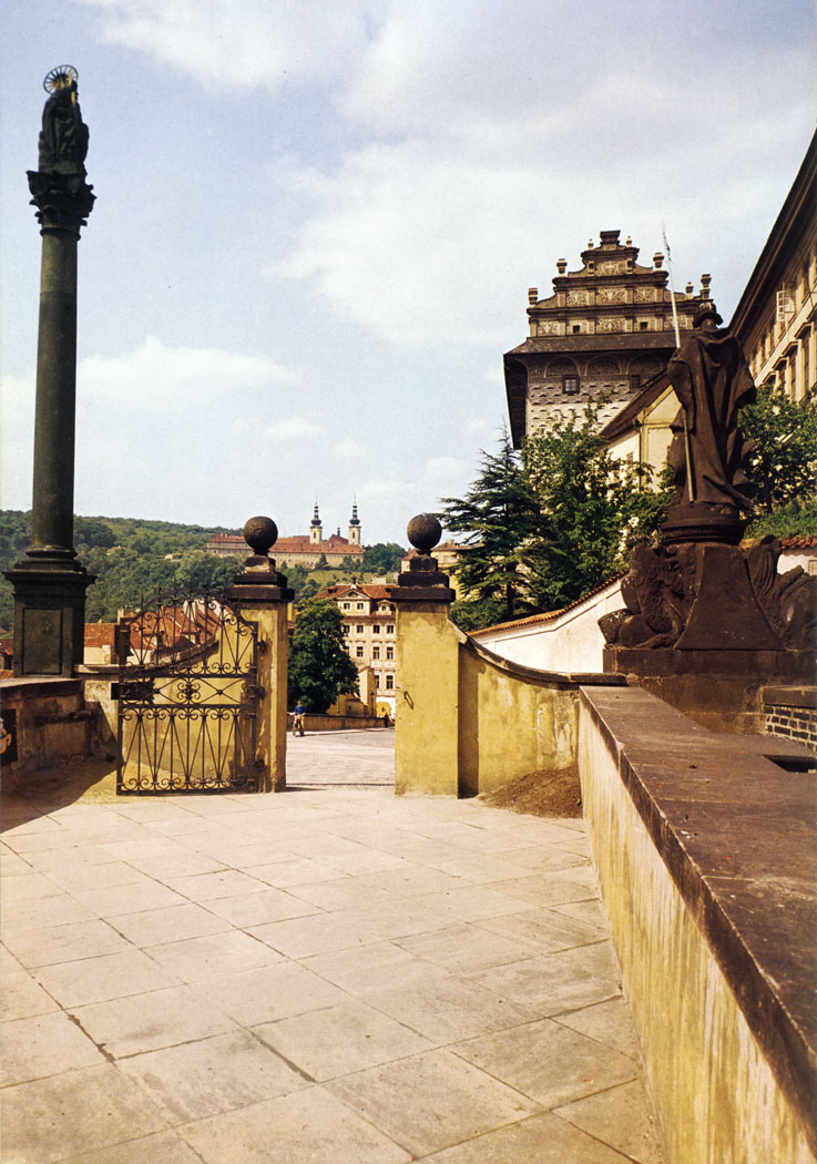 The Ramp of Prague Castle was built in 1663. It offers quite a remarkable view of the town and the slopes of Petfin Hill. In the background are the pre­cincts of the Museum of National Literature, orig­inally a Premonstratensian monastery founded in 1140.