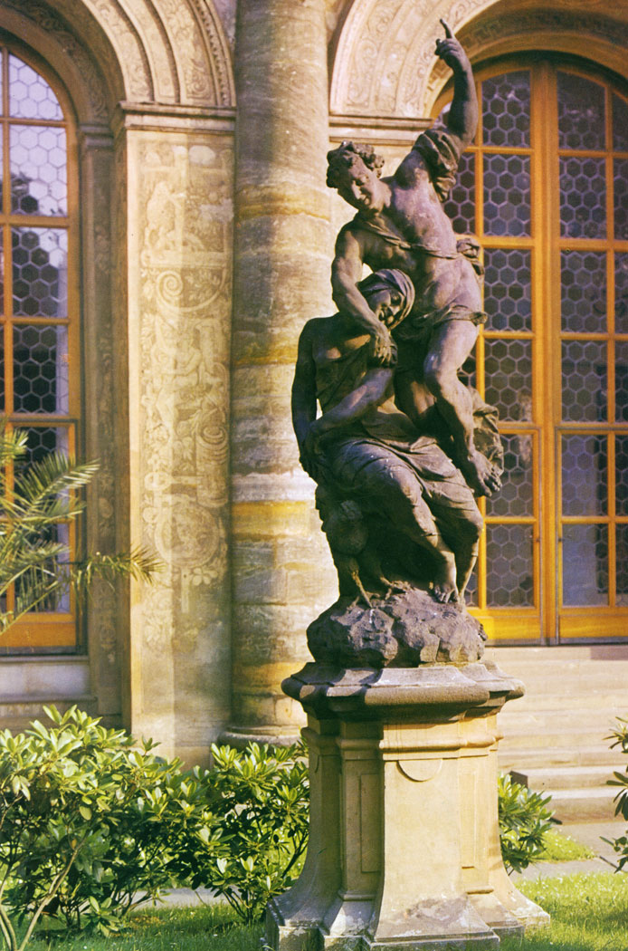 The allegorical statue of Night was made in the workshop of Matthias Braun after 1734 and was placed in the Royal Gardens shortly after that date. The Ball Court was built in Renaissance style by Bonifaz Wolmut and Oldfich Aostalis (1567 - 1569). It burnt down during the revolutionary fighting on 9 May 1945 and has been restored to a design by Pavel Janak.