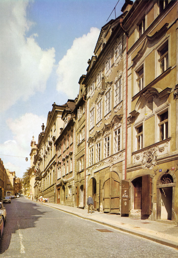 Neruda Street has kept its eighteenth century charac­ter to the present day, both in the predominance of High Baroque in the house fronts, house-signs and portals and in the optical symmetry of buildings typical of Prague Baroque.