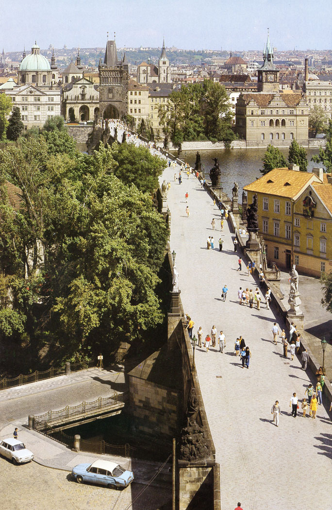 In the 13th century the Old Town and the Little Quarter sides were built up to protect the bridge. But it was not until the end of the 17th century that architect J. B. Mathey gave an artistic blend to the approaches to the Bridge on the Old Town side and created one of the most picturesque squares in Prague.