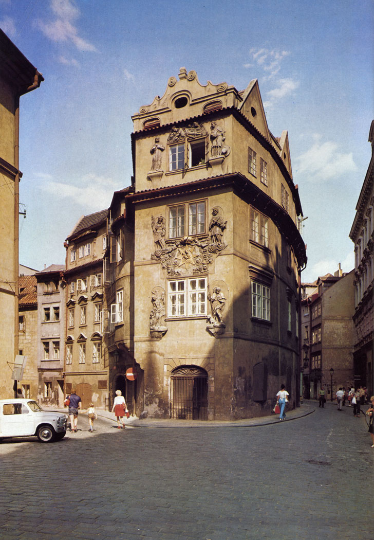The picturesque house At the Golden Well (U zlate studne) at the corner of Seminafska and Karlova streets kept its compact character given by the dimensions of Gothic building lots even after Re­naissance alterations. The rich stucco decorations were made in 1701.